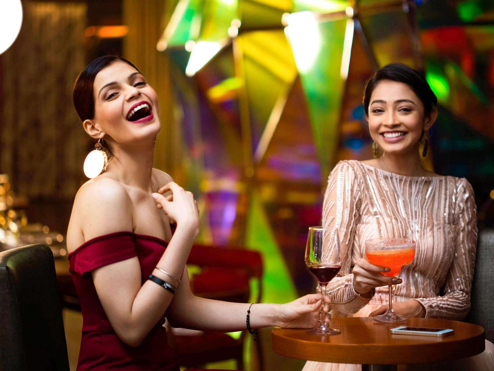 Novotel Kolkata Hotel And Residences Exterior foto Two women socializing